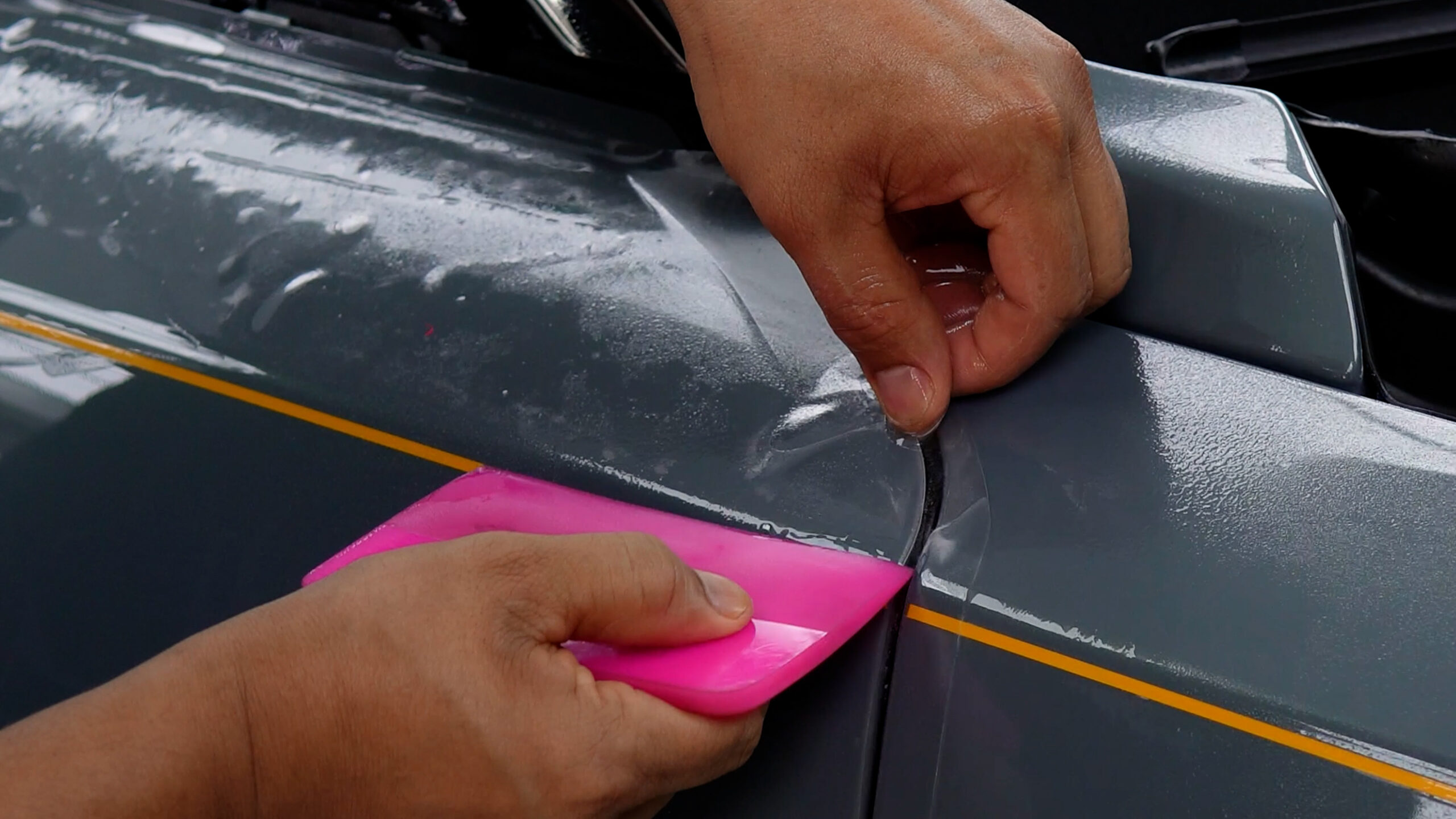 Precision Color PPF edge finishing on Rolls-Royce Ghost panel with gold coachline