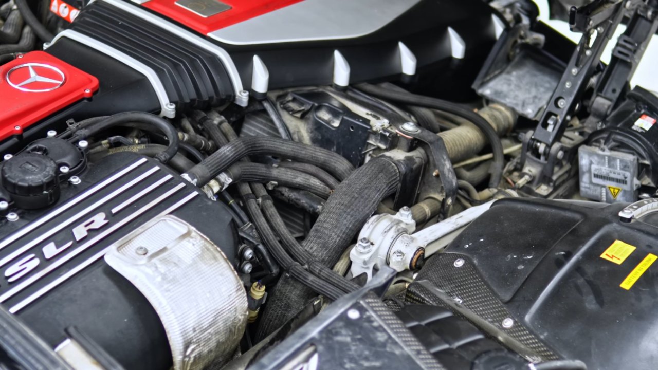 Mercedes-Benz SLR McLaren engine bay before dry ice cleaning, covered in dust and road grime