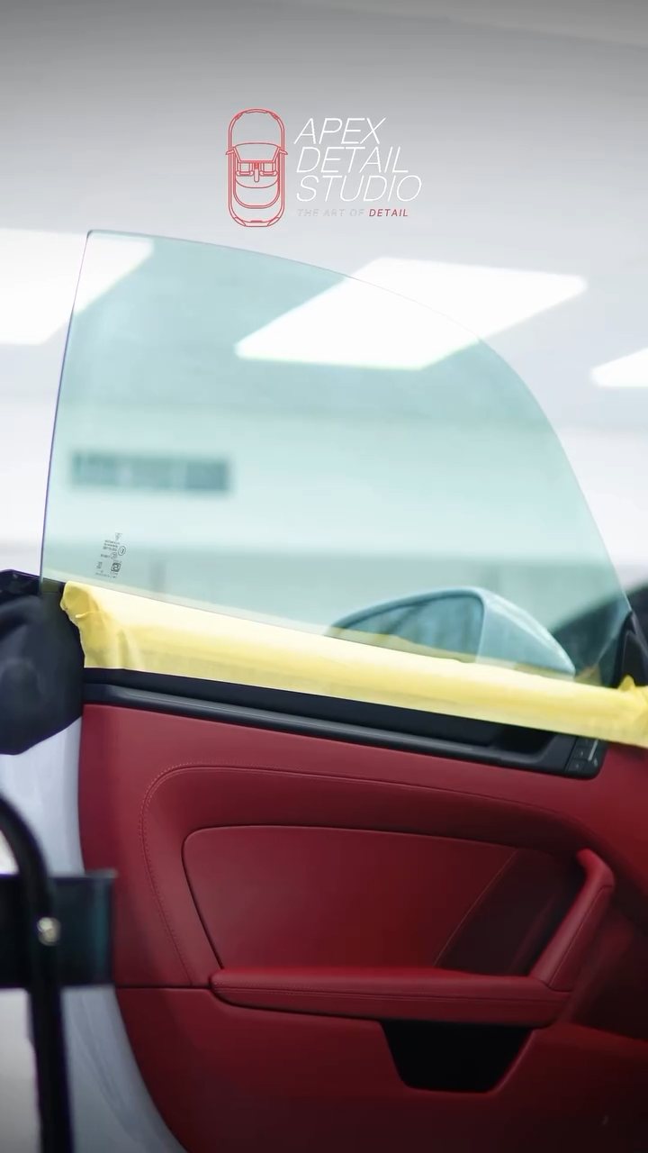 Porsche 911 Carrera GTS red door interior with tinted glass in Dubai