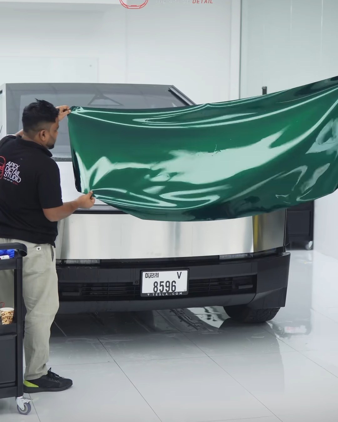 Green colour PPF being laid over the stainless steel of a Tesla Cybertruck at Apex Detail Studio